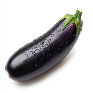 A solitary eggplant rests on a white surface, adorned with glistening water droplets.