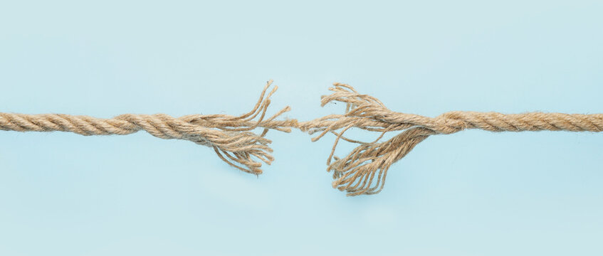 Frayed rope on color background