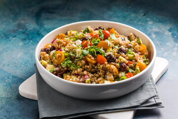 Farro salad. Cooked whole grain cereal spelt as salad with vegetables and feta cheese