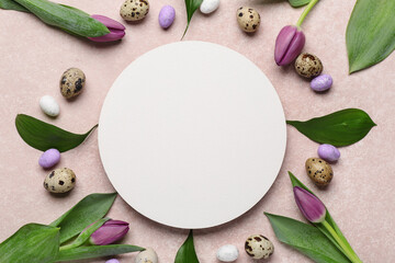 Blank card with Easter eggs and tulip flowers on beige background
