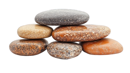 Stack of smooth, rounded stones in earthy tones,isolated on black background