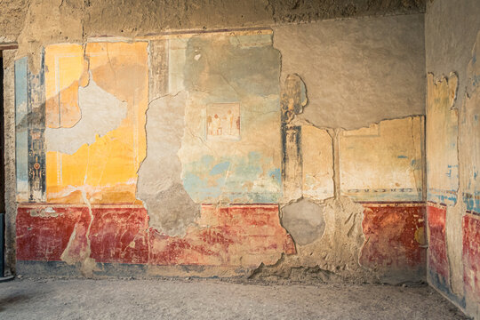 Ancient Wall Fresco in Pompeii Highlighting Vibrant Colors and Erosion Effects