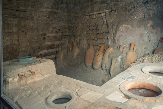 Ancient Storage Room with Amphorae and Artifacts in Pompeii, Italy