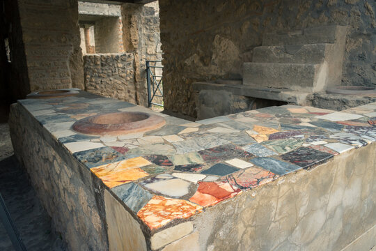 Ancient Stone Countertop in Pompeii, Italy Showcasing Colorful Mosaic Tiling