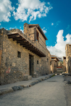 Ancient Stone Street in Pompeii Under a Vibrant Blue Sky
