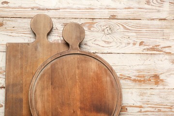 Wooden cutting boards on white table