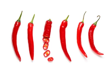 Fototapete Red cut chili peppers on white background. Top view © Pixel-Shot