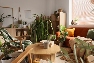 Interior of modern living room with green houseplants