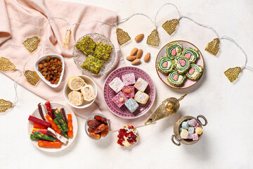Different Turkish delight on white grunge background. Ramadan celebration