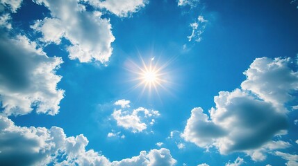 Bright Blue Summer Sky with Sunlight and Fluffy White Clouds