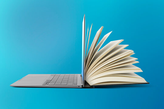 Open book and laptop on light blue gradient background. E-learning, internet library, online webinar