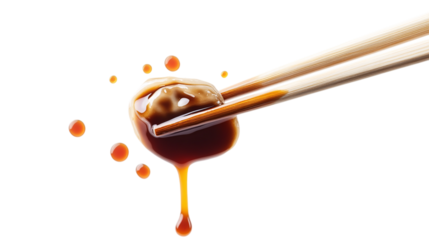 Delicious dumpling held with chopsticks, dripping soy sauce, cut out. Isolated on a transparent background.