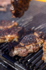 A sizzling, juicy steak is being expertly cooked on a barbecue grill, producing an incredibly delicious smoky flavor along with beautiful char marks that enhance its great appearance and taste