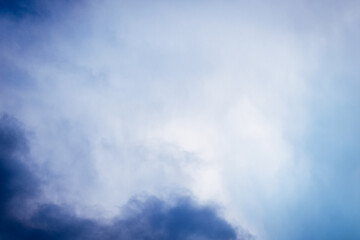 Stormy Cloudscape. blue and gray clouds. Cloud in the background. Phone or desktop wallpaper.