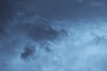 Stormy Cloudscape. blue and gray clouds. Cloud in the background. Phone or desktop wallpaper.