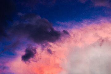 A colorful sky with clouds.A pink and purple sky with a pink cloud in the background. Phone or desktop wallpaper.