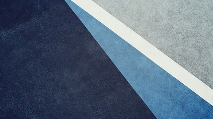 Fototapeta premium diagonal athletic court markings on textured rubber surface, muted blue and grey color scheme, safety playground flooring texture, geometric sports field lines, minimalist outdoor sports photography,