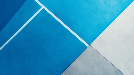 Fototapeta premium overhead view of athletic court materials, sleek blue and grey color transition, detailed rubber surface grain, bold diagonal boundary line, modern sports facility photography, professional