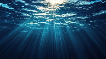 Obraz premium Deep Blue Ocean With Golden Sunbeams Piercing Abyss Below