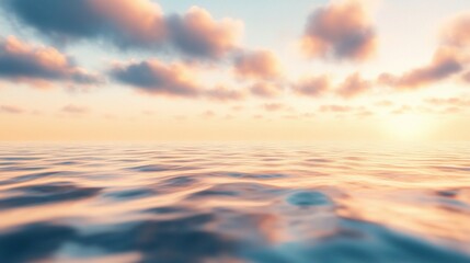 Obraz premium Serene Sunset Over Calm Sea with Soft Clouds and Gentle Colors