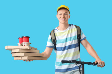 Male courier with pizza boxes and coffee riding kick scooter on blue background
