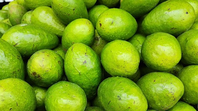 Pile of fresh avocado fruits in the traditional market 