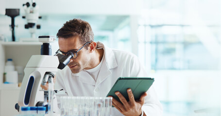 Man, microscope and tablet for results with science for medical study with container, review and space. Person, digital touchscreen and app for chemical analysis with pharma for vaccine development © peopleimages.com