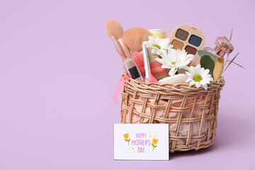 Basket with cosmetic gifts for Mother's Day on lilac background