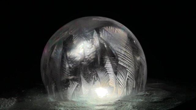 If you slowly make soap bubbles in sub-zero temperatures, the surface will freeze and you can see beautiful art.