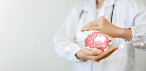 Doctor holding brain. surgeon analyzing patient brain testing result. innovative in science and...