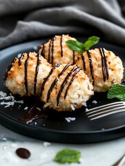 Delicious Coconut Macaroons with Chocolate Drizzle and Fresh Mint Garnish