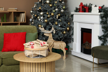 Basket with Christmas Advent calendar on table in living room