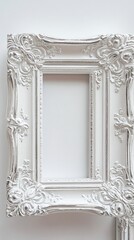 Obraz premium Ornate White Picture Frame with Silver Accents on White Background