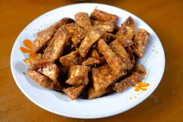 batata chips with palm sugar served on a plate. Sweet potato chips 