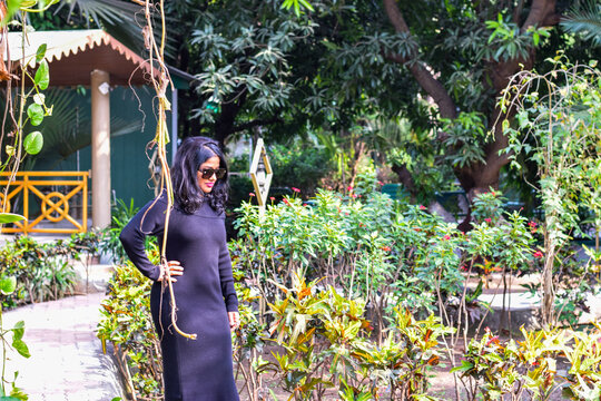 Indian female model in black dress posing for photograph
