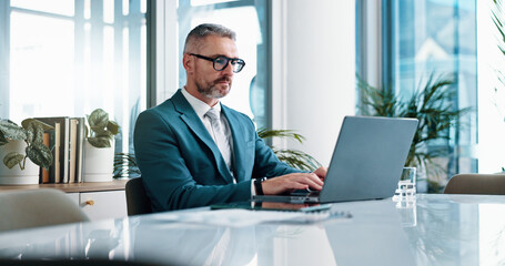 Accountant, laptop and mature business man in office for financial analysis, budget review and...