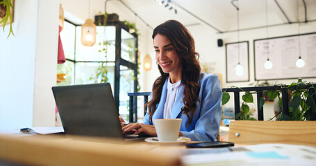 Happy, business and laptop with woman in cafe for typing, remote worker and research. Planning, client feedback and online review with female person in coffee shop for email, idea and update