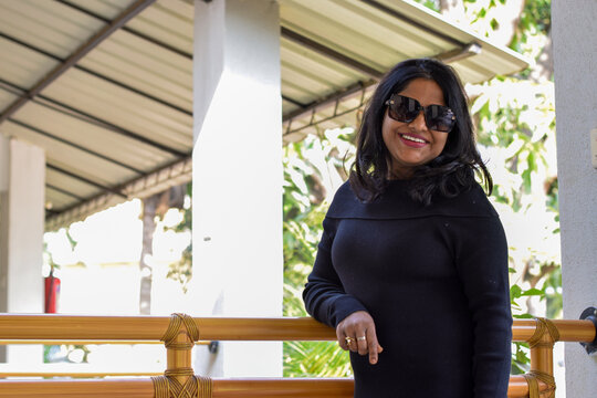Indian female model in black dress posing for photo graph