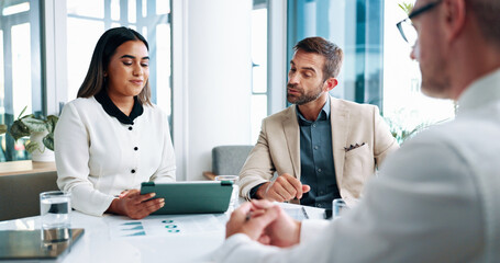 Fototapeta premium Meeting, tablet and business people in office with planning for company investment. Discussion, documents and team of financial advisors with profit, revenue or dividend chart for finance proposal