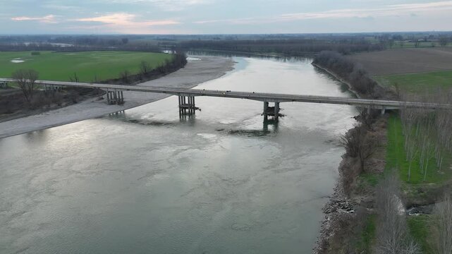 Aerial view capturing the Verdi Bridge over the Po River, connecting Seniga in Parma province with San Daniele Po in Cremona, highlighting Northern Italy's scenic beauty
