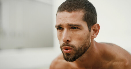 Obraz premium Breathing, outdoor and man with fitness, exercise and calm with rest, wellness and challenge. Healthy person, athlete and guy in street, training or workout with runner, tired or exhausted with break