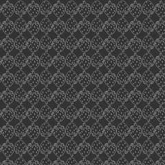 Seamless vector pattern of red strawberries with green leaves on a black background, perfect for textiles and designs