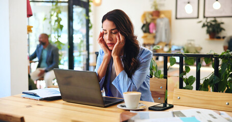 Obraz premium Remote work, headache and woman in cafe with stress, sick or overwork with burnout on laptop. Migraine, tired and person in coffee shop with pain, fatigue and freelancer massage temples for brain fog