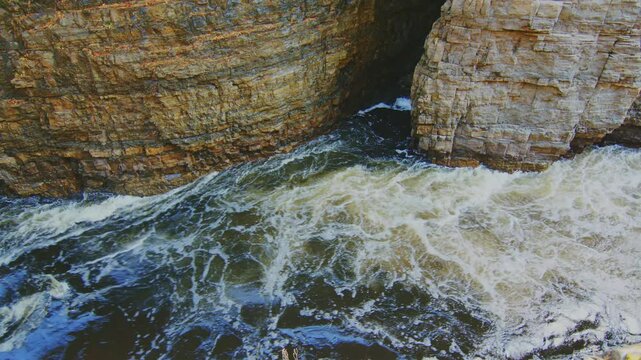 A mesmerizing shot of the Ausable Chasm Canyon, where the mountain river flows through the deep, narrow chasm in Keeseville, NY, offering a stunning visual experience.