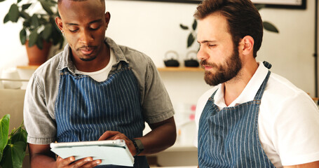 Tablet, barista team and men in coffee shop for planning menu, schedule and stock for online order in startup. Technology, waiters and discussion in cafe for small business, check inventory or sales