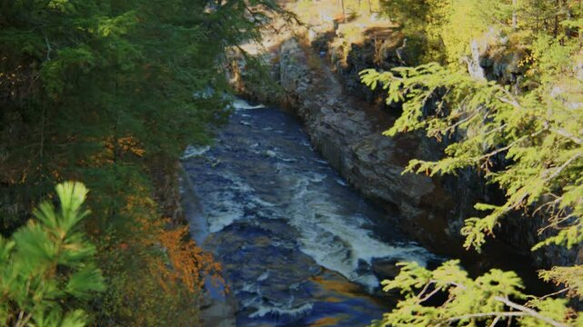 Explore the beauty of the Ausable Chasm, a natural sandstone gorge in the Adirondacks, renowned for its dramatic landscapes and flowing river, offering a stunning visual experience.