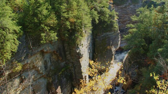 Stunning 4K footage of the Ausable Chasm Canyon, with a mountain river flowing through the natural gorge in Keeseville, NY, capturing the raw beauty of the Adirondacks.