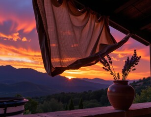 Sunset view from a rustic balcony with lavender in a vase and draping fabric in the foreground