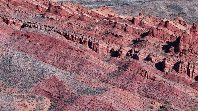 Aerial red rock mountain ledge landscape southern Utah 1 4K. Southwestern desert St George. Geological landscape wind, weather and water carved erosion, spectacular beautiful mountain valley. River.