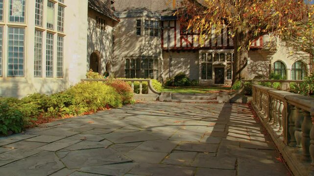 Footage showcasing Coe Hall, a historic 65-room Tudor Revival mansion in Planting Fields Arboretum, Oyster Bay, NY, built between 1918 and 1921, a significant architectural landmark.